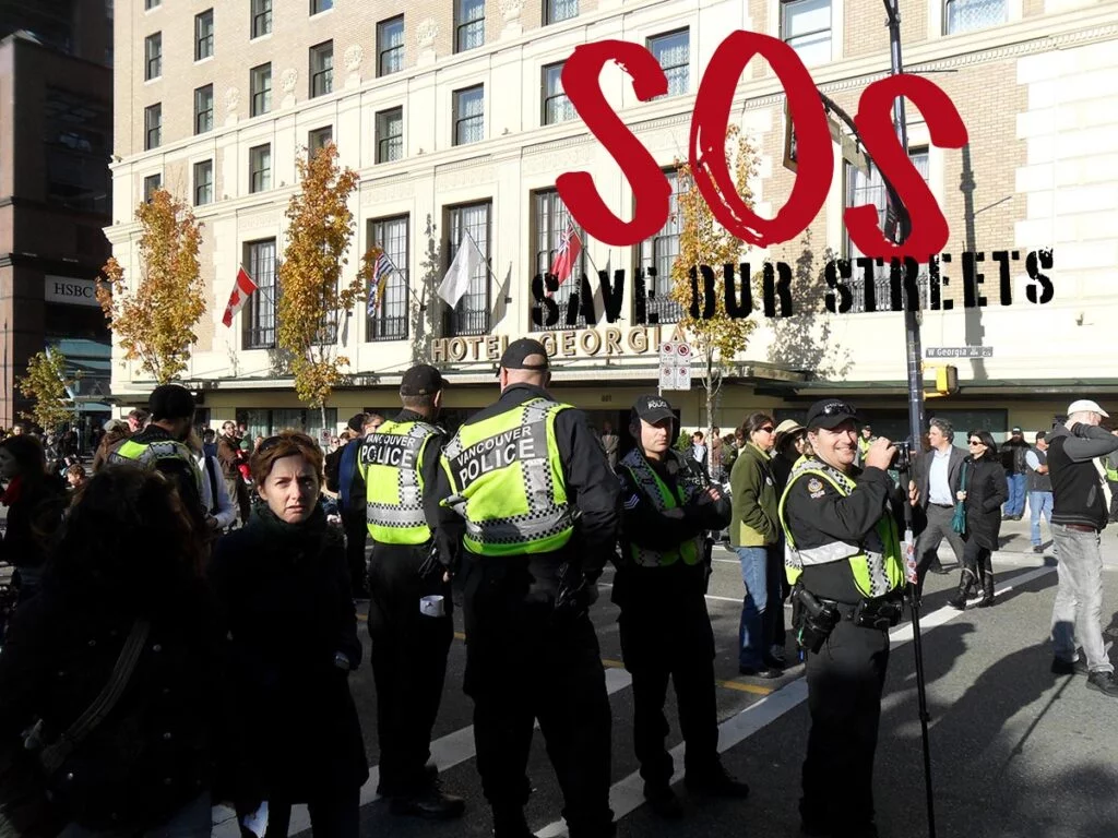 Police containing a crowd of people in Downtown Vancouver amidst the growing concern of local citizens with their community's safety.