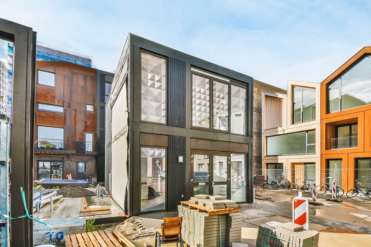 Prefabricated houses at various stages of construction demonstrate a possible path British Columbia can take to tackle its housing crisis.