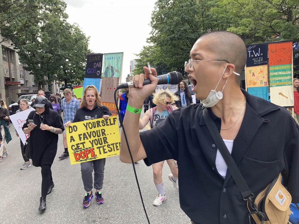 Crowd matching down the East Hastings in Vancouver, BC in support of decriminalization and changes to the Drug Policy