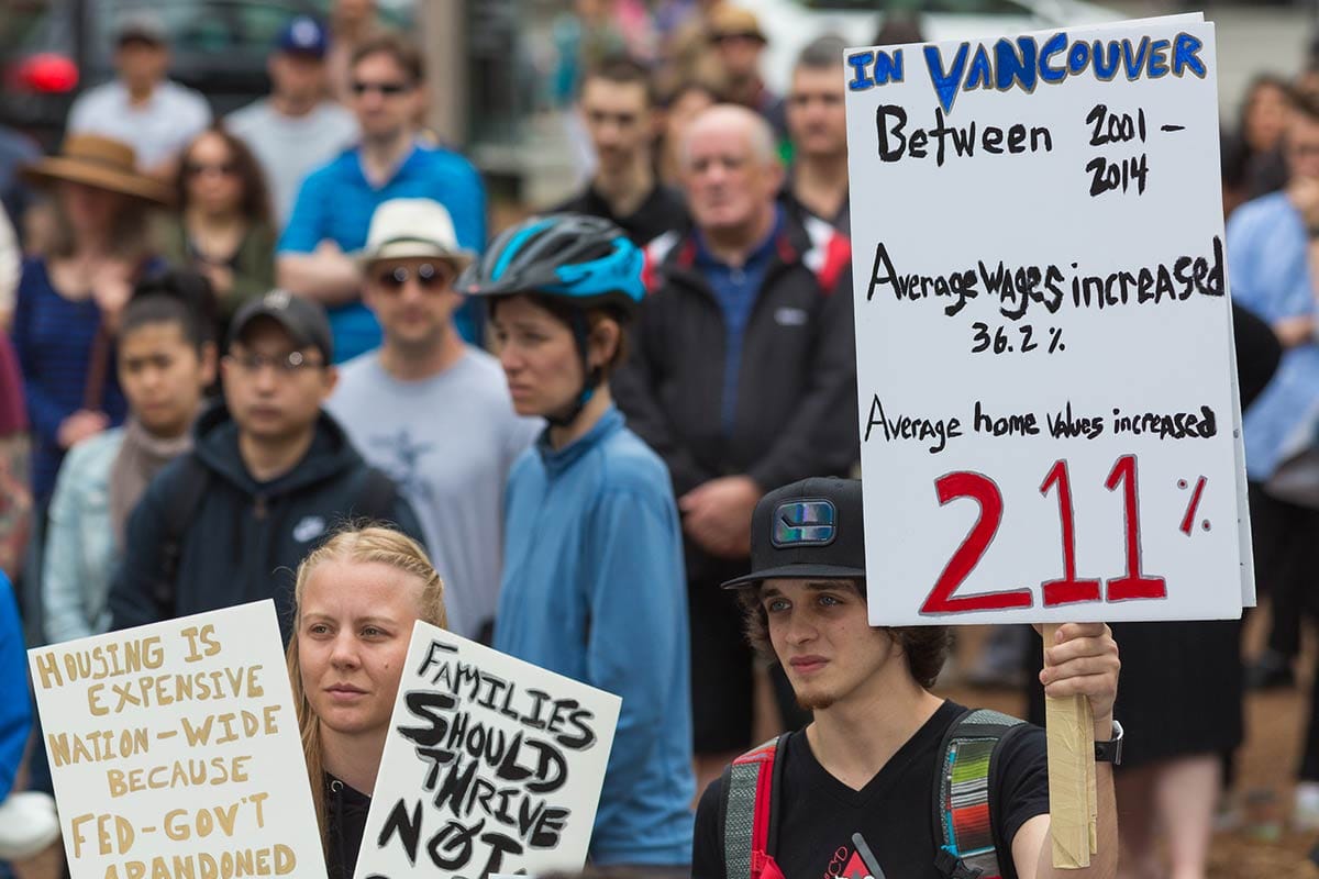 Vancouver residents captured at Affordable Housing Protest holding posters calling for more affordable housing