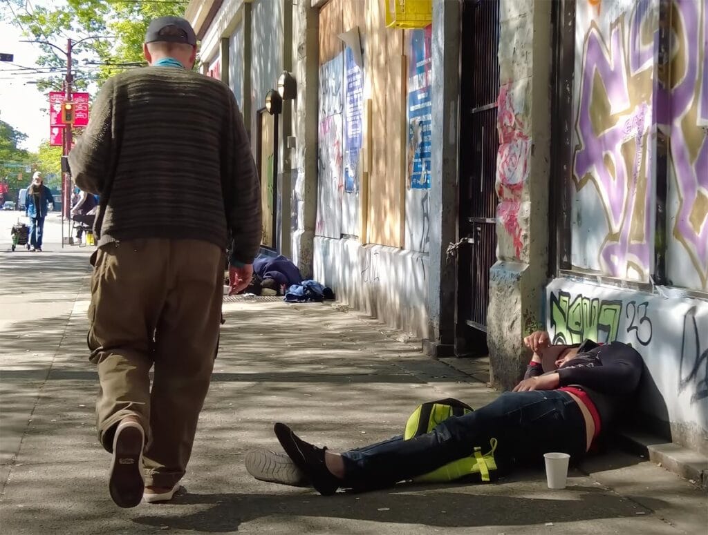Pictured are numerous drug users on the sidewalks of East Hastings Street Vancouver, British Columbia