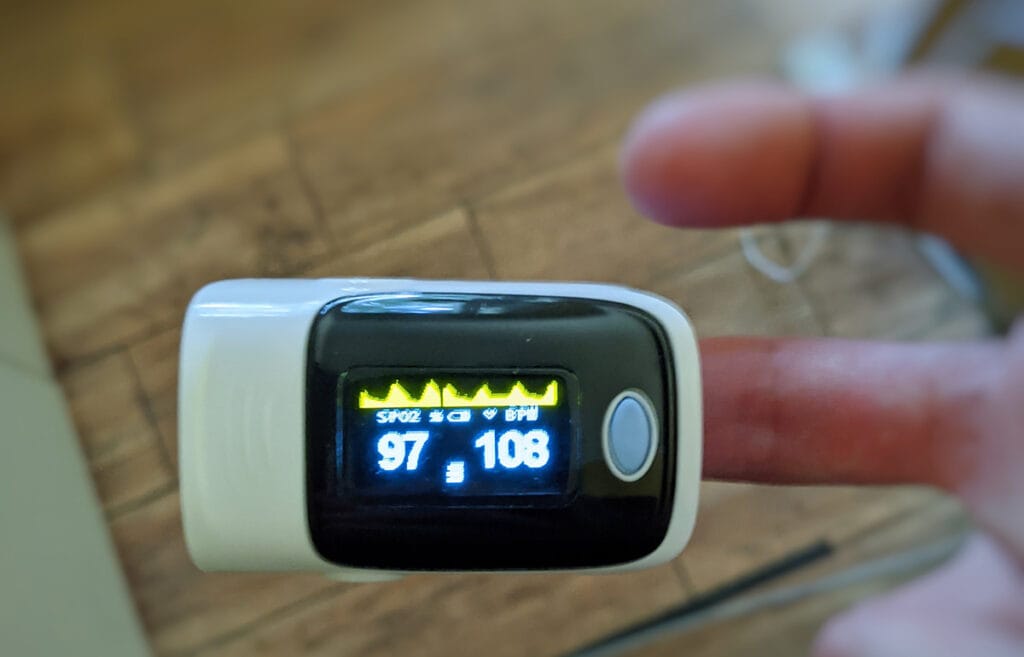 Pictured is pulse oximetry device measuring pulse and other vital metrics