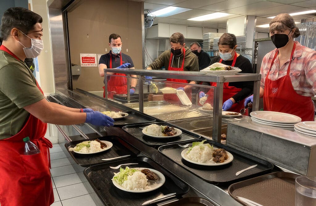 Volunteers of Vancouver's Salvation Army Harbour Light Program are pictured serving Thanksgiving turkey meals to those in need in Downtown Eastside.