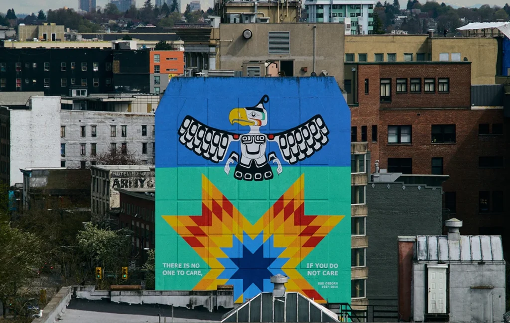 An image of highly dense downtown core with different types of housing and public art