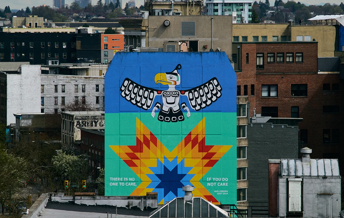 An image of highly dense downtown core with different types of housing and public art