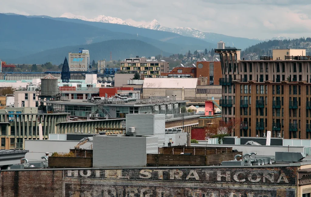 Image of dense Vancouver Downtown architecture with North Shore Mountains in the background