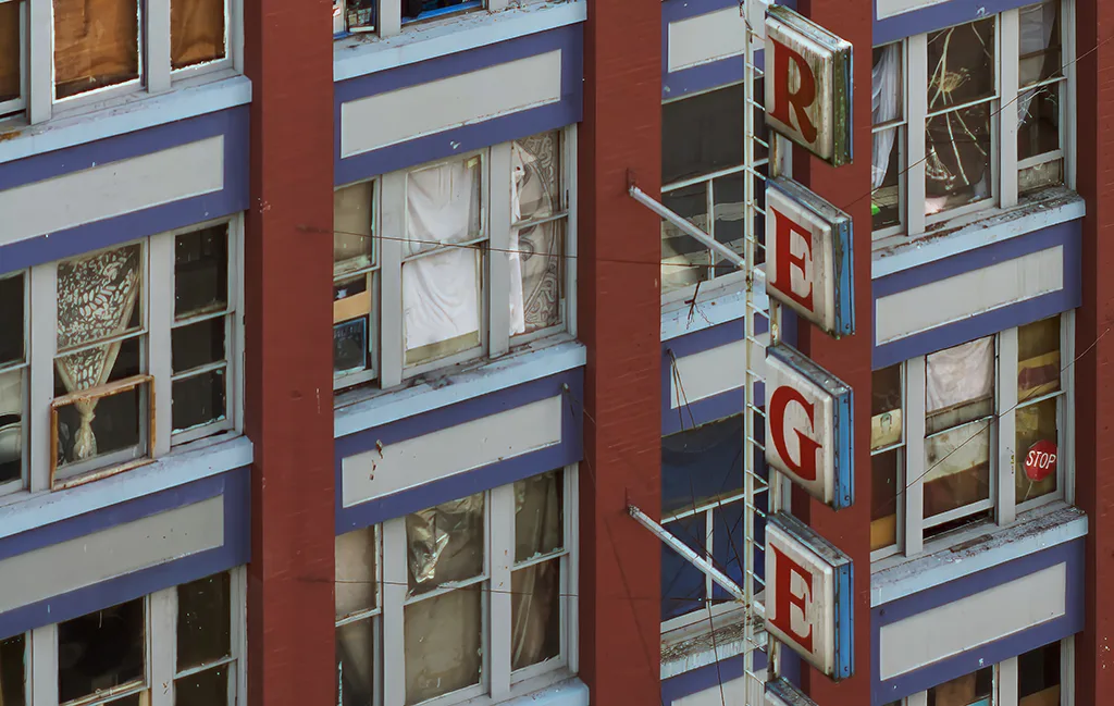 Exterior view of the vacant Regent Hotel, a former SRO building, standing in disrepair on East Hastings Street in Vancouver.