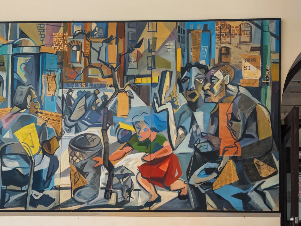 Close-up of a section of Richard Tetrault's collaged mural featuring expressionist figures, newspaper clippings, and abstract street elements.